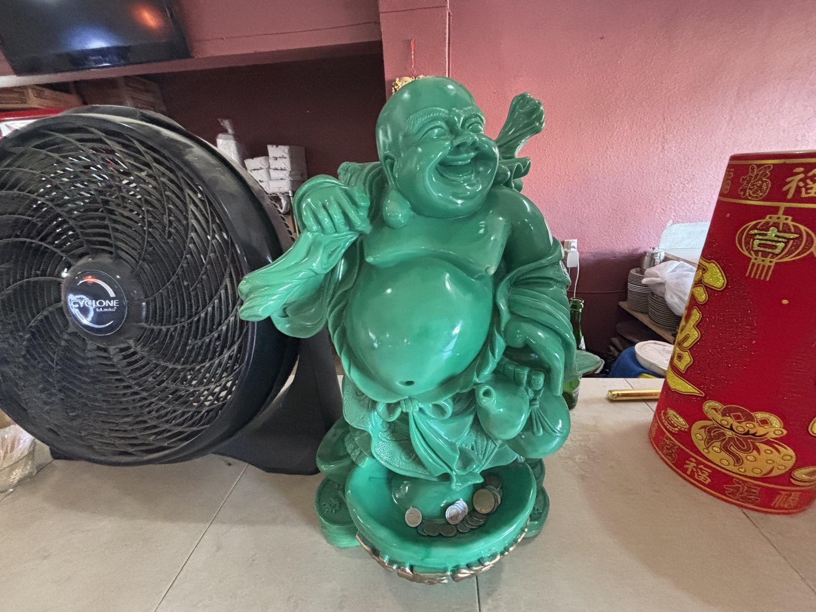 Jade laughing Buddha by the door