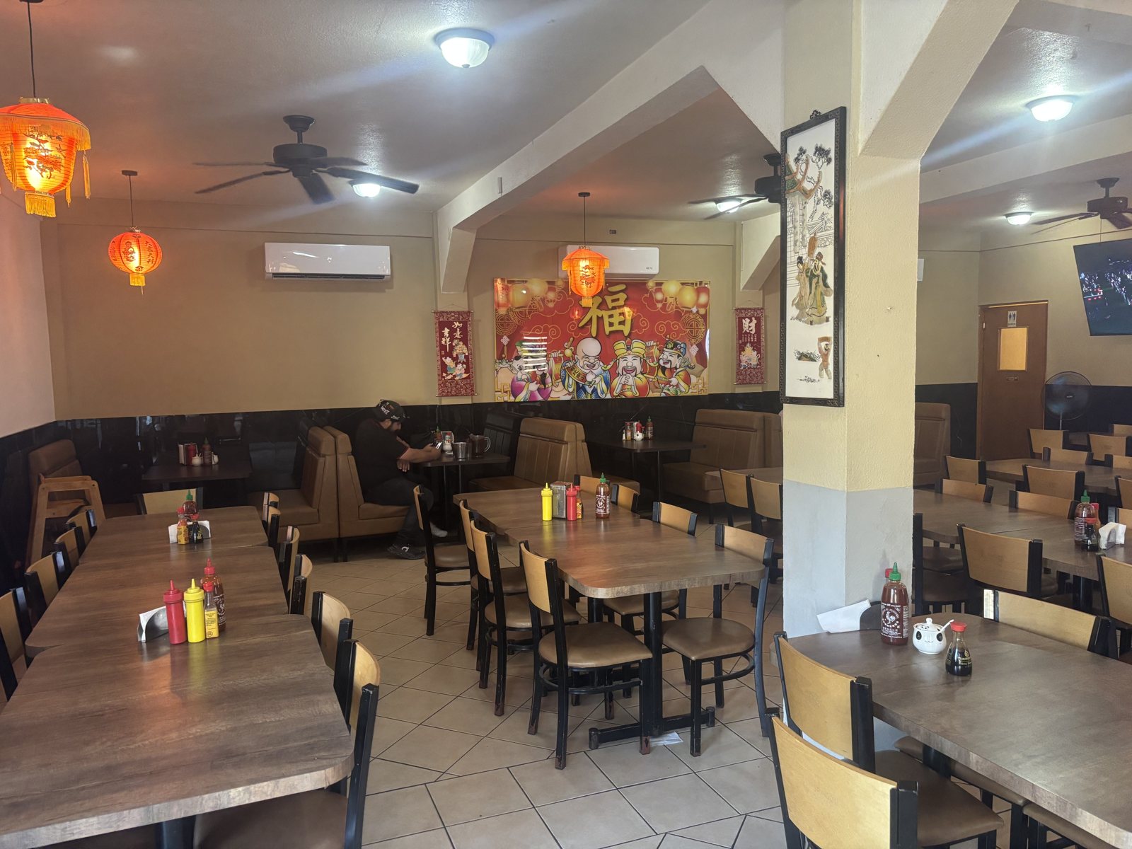 Dining room booths under red lanterns